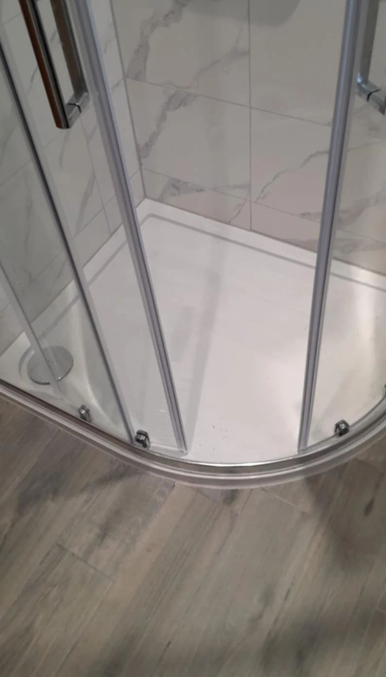 Shower tray with sliding glass door